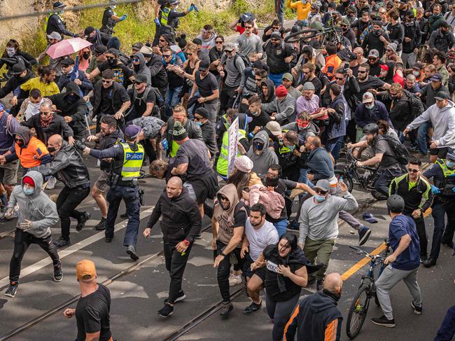 The moment police were overrun by the wild crowd. Picture: Jason Edwards