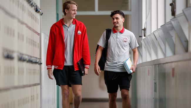 Jack Lukosius and Izak Rankine head to class at Henley High School. Picture: Matt Turner.