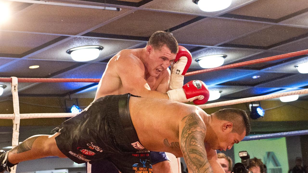 Paul Gallen (left) and Hermann Ene-Purcell fight it out in Toowoomba. Friday, Jan 29, 2016.