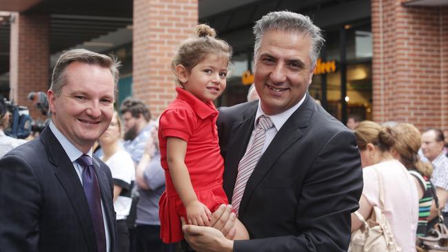 Chris Bowen and Frank Carbone with a young child in 2015 at a local shopping mall opening. Picture: Timothy Clapin