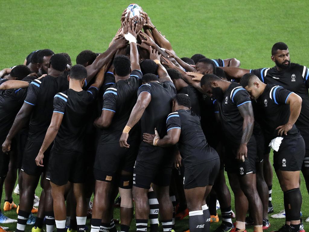 Fiji players pray ahead of their captain’s run at the Sapporo Dome on Friday. Picture: AFP