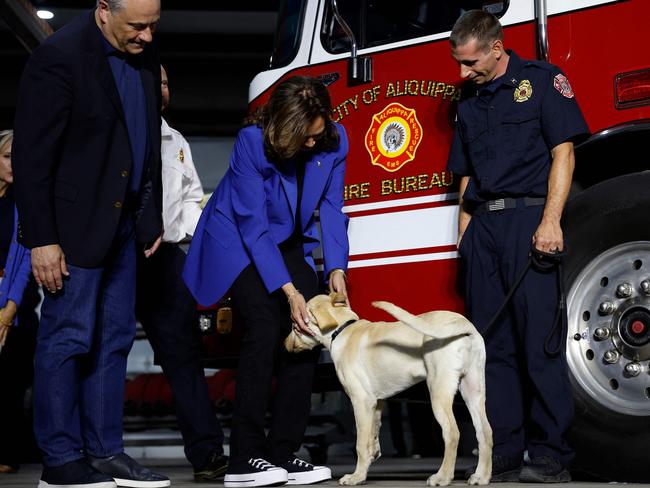 Vice President Kamala Harris and Doug Emhoff greet a team of firefighters and their dog in Aliquippa, Pennsylvania. Picture: Getty Images via AFP