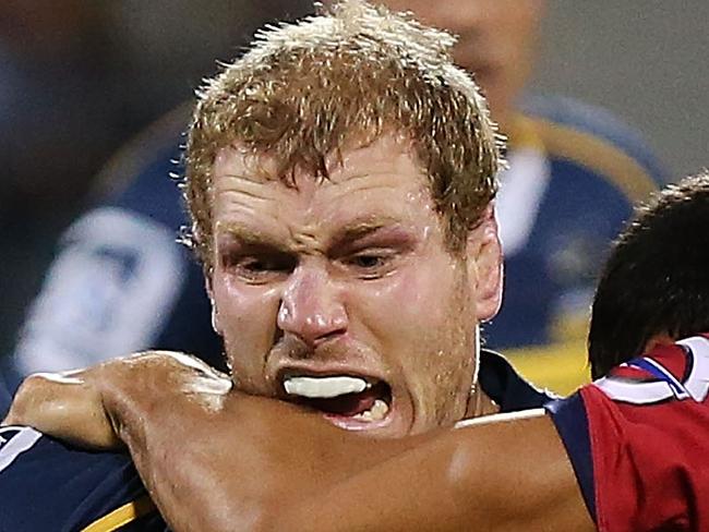 CANBERRA, AUSTRALIA - FEBRUARY 13: David Pocock of the Brumbies is tackled during the round one Super Rugby match between the Brumbies and the Reds at GIO Stadium on February 13, 2015 in Canberra, Australia. (Photo by Stefan Postles/Getty Images)