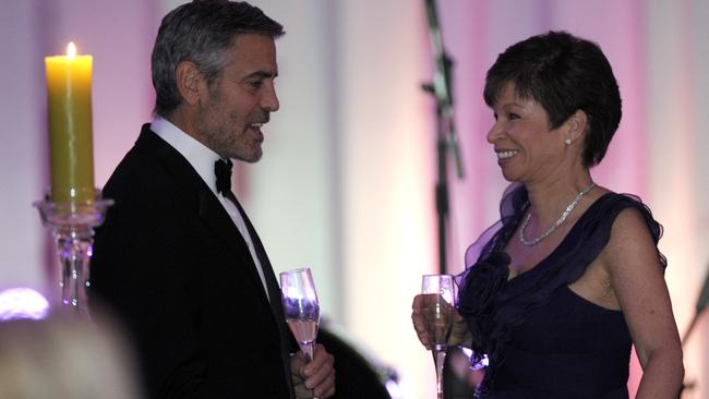 George Clooney talks with Valerie Jarrett before a State Dinner with then president Barack Obama at the White house in Washington.