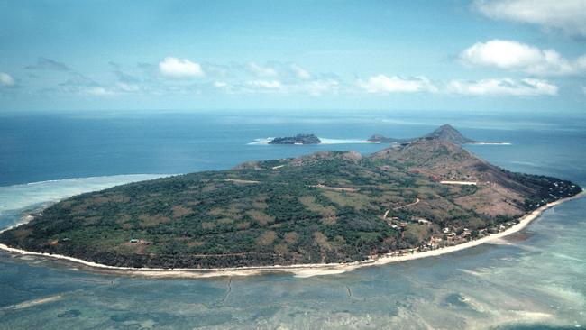 An aerial view of Murray Island showing the airstrip in the centre of the island.