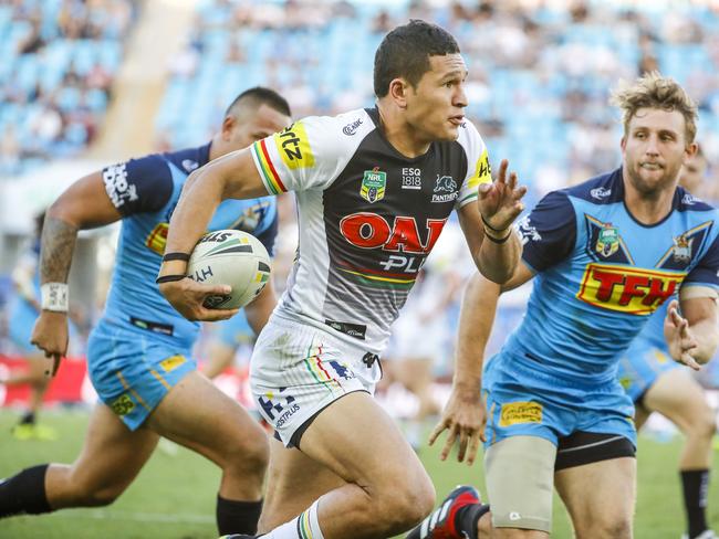 Dallin Watene-Zelezniak of the Panthers (centre) runs with the ball during the Round 22 NRL match between the Gold Coast Titans and the Penrith Panthers at Cbus Super Stadium on the Gold Coast, Saturday, August 11, 2018. Picture: AAP Image/Glenn Hunt