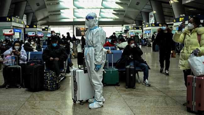 A passenger wearing full protective gear a train station in Beijing on Wednesday. Picture: AFP