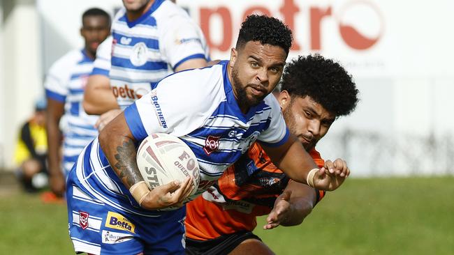 Brothers' Patrick Lewis attempts to break through the Tully Tigers defence. Picture: Brendan Radke