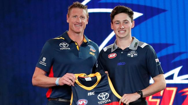 Adelaide football manager Brett Burton with No. 9 draft pick Chayce Jones from Tasmania. Picture: Adam Trafford (Getty).