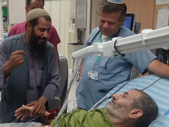 Kaid Alkadi talking to his brother in hospital. Picture: AFP