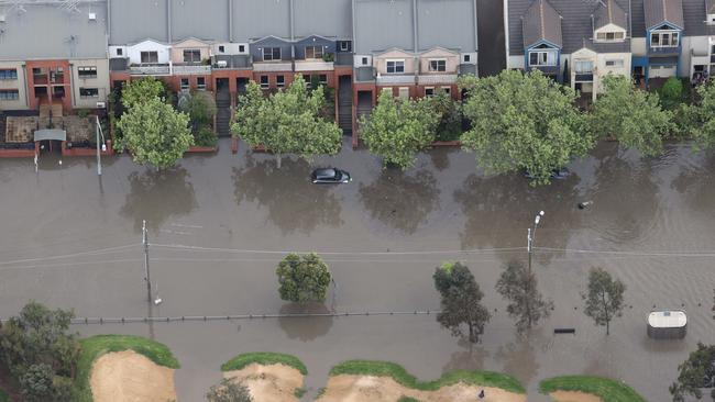 A car floats in floodwater in the Flemington area of Maribyrnong. Picture: David Caird