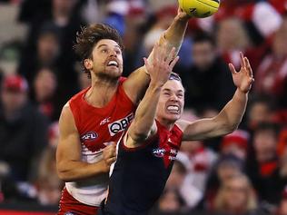 AFL Round 15. Melbourne vs. Sydney Swans at the MCG. Sydney's Dane Rampe spoils from behind Melbourne's Jayden Hunt  . Pic: Michael Klein