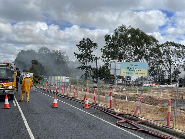 More than 50 firefighters, including fire investigations units, are still on scene at Koplick St, Park Ridge after the fire destroyed a shed full of tyres and oil drums. Picture: Brayden Heslehurst