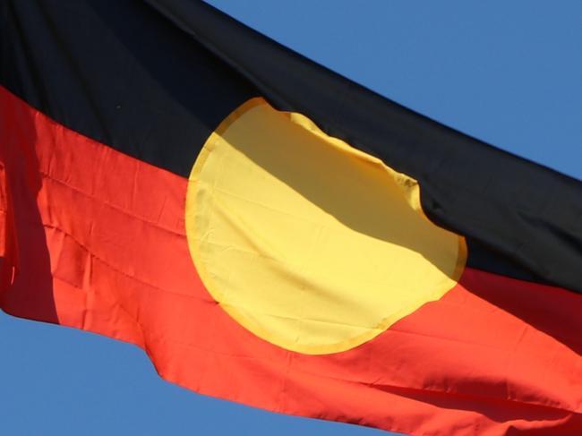 The Aboriginal flag is now flying over the Stuart Highway and Bagot Rd intersection for the first time after the NT Government spent about $220,000 constructing new flag poles.