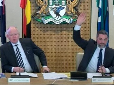 Liverpool Mayor Ned Mannoun (right) voting in favour of his motion alongside acting chief executive Jason Brenton.