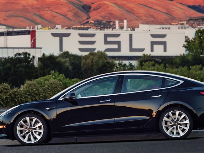 This undated image provided by Tesla Motors shows the Tesla Model 3 sedan. The electric car companyâ€™s newest vehicle, the Model 3, which set to go to its first 30 customers Friday, July 28, 2017, is half the cost of previous models. Its $35,000 starting price and 215-mile range could bring hundreds of thousands of customers into Teslaâ€™s fold, taking it from a niche luxury brand to the mainstream. (Courtesy of Tesla Motors via AP)