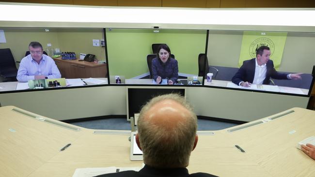 Scott Morrison speaks with Jim McDowell, chief executive of SA’s Department of Premier and Cabinet, NSW Premier Gladys Berejiklian and WA Premier Mark McGowan during a national cabinet meeting. Picture: AAP