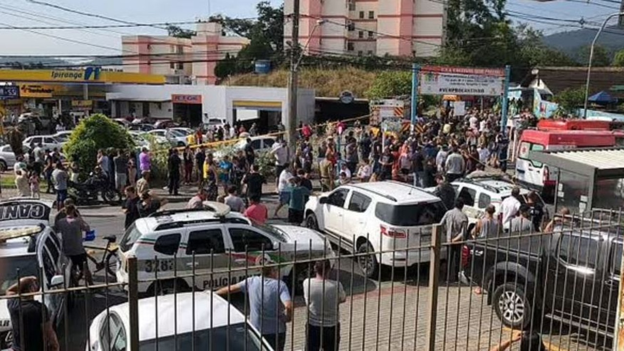 Crowds gathered outside as they waited to collect their children. Picture: Twitter