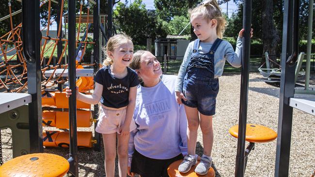 Chloe Tysoe with daughters Poppy and Cedah enjoy a day out at a playground in South Yarra. Picture: Aaron Francis