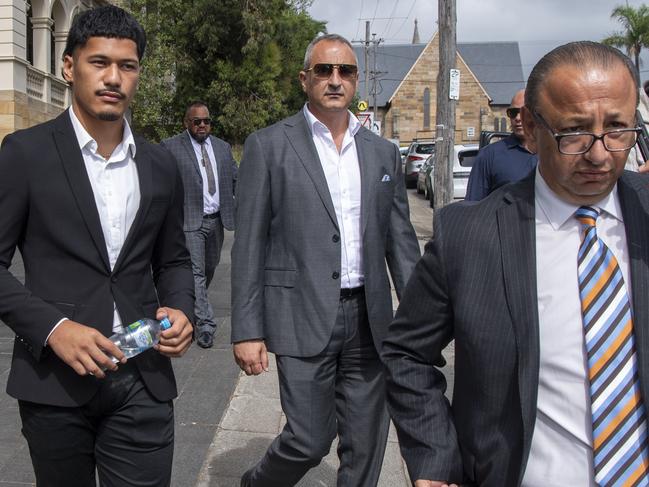 SYDNEY AUSTRALIA - NewsWire Photos, 11 DECEMBER, 2023: St George Illawarra Dragons player, Talatau Amone (dark suit) charged over his role in an alleged rooftop hammer attack leave Wollongong Court before sentencing.Picture: NCA NewsWire / Simon Bullard.