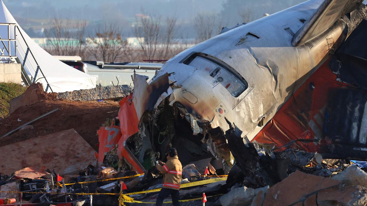 The disaster killed everyone aboard except two flight attendants pulled from the burning wreckage. Picture: Yonhap/AFP