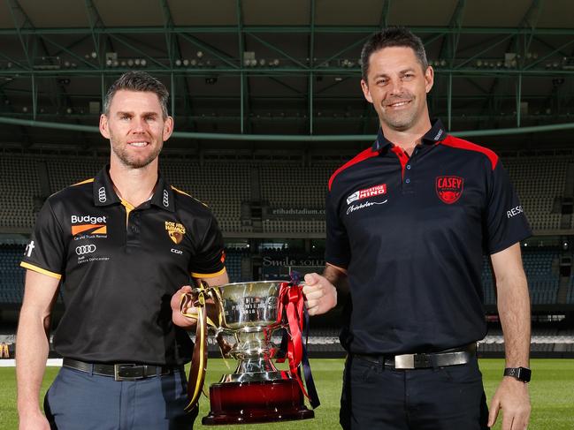 At Etihad on September 18, Box Hill Hawks coach Chris Newman and Casey coach Jade Rawlings show off the 2018 VFL premiership cup.