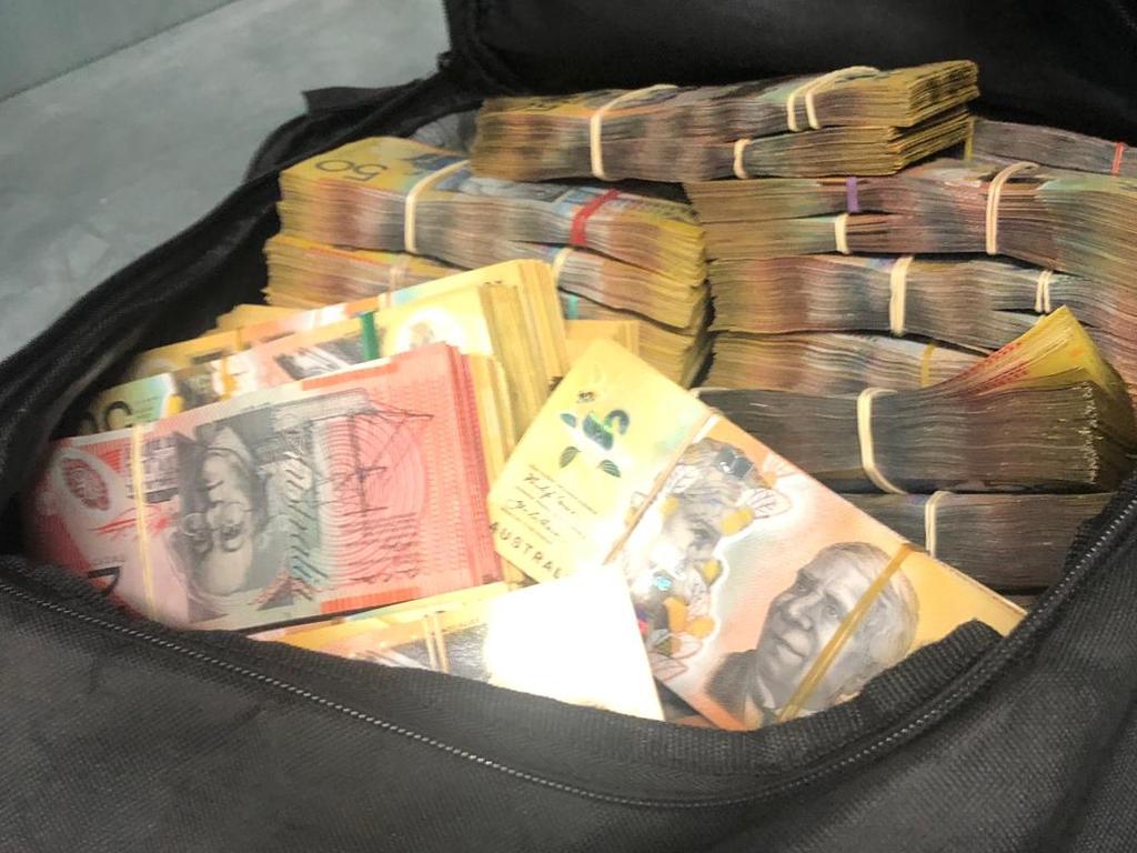 A bag of cash seized from a storage unit in Sydney’s south. Picture AFP