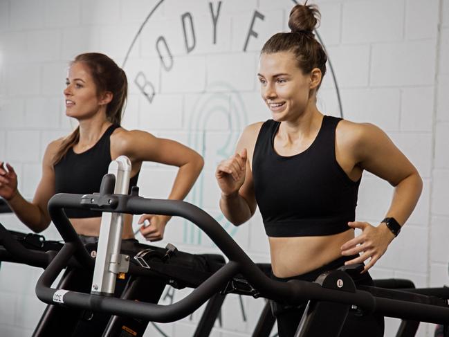 Clients exercise inside a Body Fit facility. Australian sports stars including former NRL players and brothers Mitch and James Aubusson, St Kilda legend Nick Riewoldt, Test captain Tim Paine and ex cricketer George Bailey are among those who have opened Body Fit Training studios. Picture: Supplied/Body Fit Training