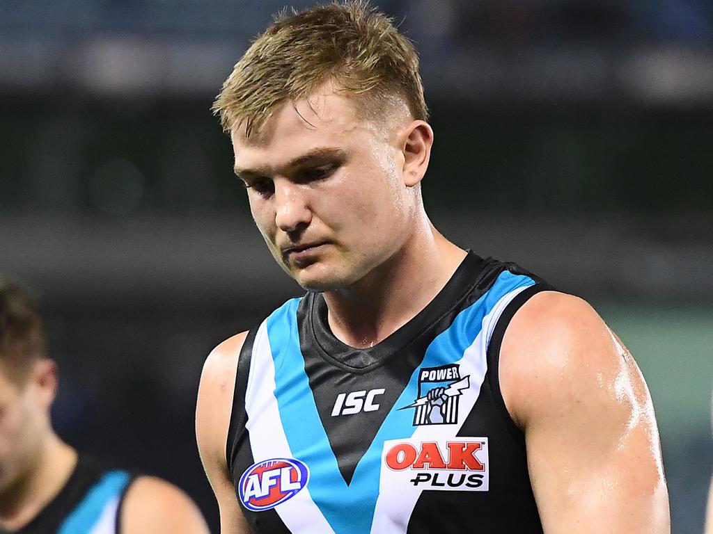 MELBOURNE, AUSTRALIA - AUGUST 17: Ollie Wines and his Power team mates look dejected after losing the round 22 AFL match between the North Melbourne Kangaroos and the Port Adelaide Power at Marvel Stadium on August 17, 2019 in Melbourne, Australia. (Photo by Quinn Rooney/Getty Images)