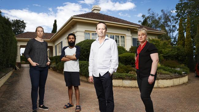 Sandy Bay tenants Elly Stone and Nikesh Todi alongside owner of the property Stephen Hannan and PRD real estate agent and property manager Jane Donoghue. Picture: Zak Simmonds