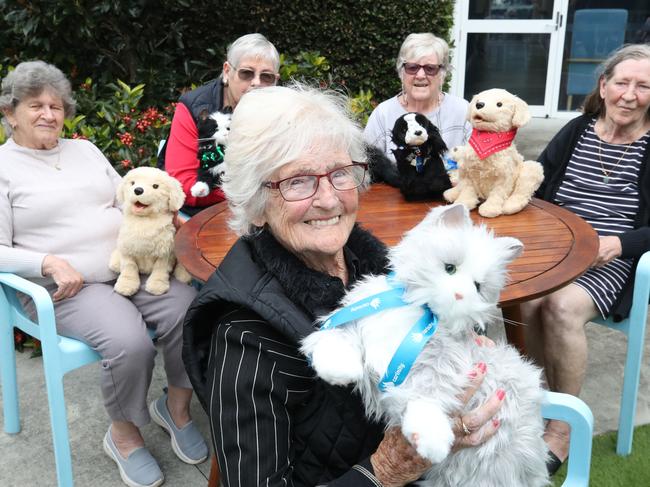The Carinity Cedarbrook aged care centre in Mudgeeraba is using robot animals as part of their animal-assisted therapy program. Helen Whitney and other residents with their Robot Pets. Picture Glenn Hampson