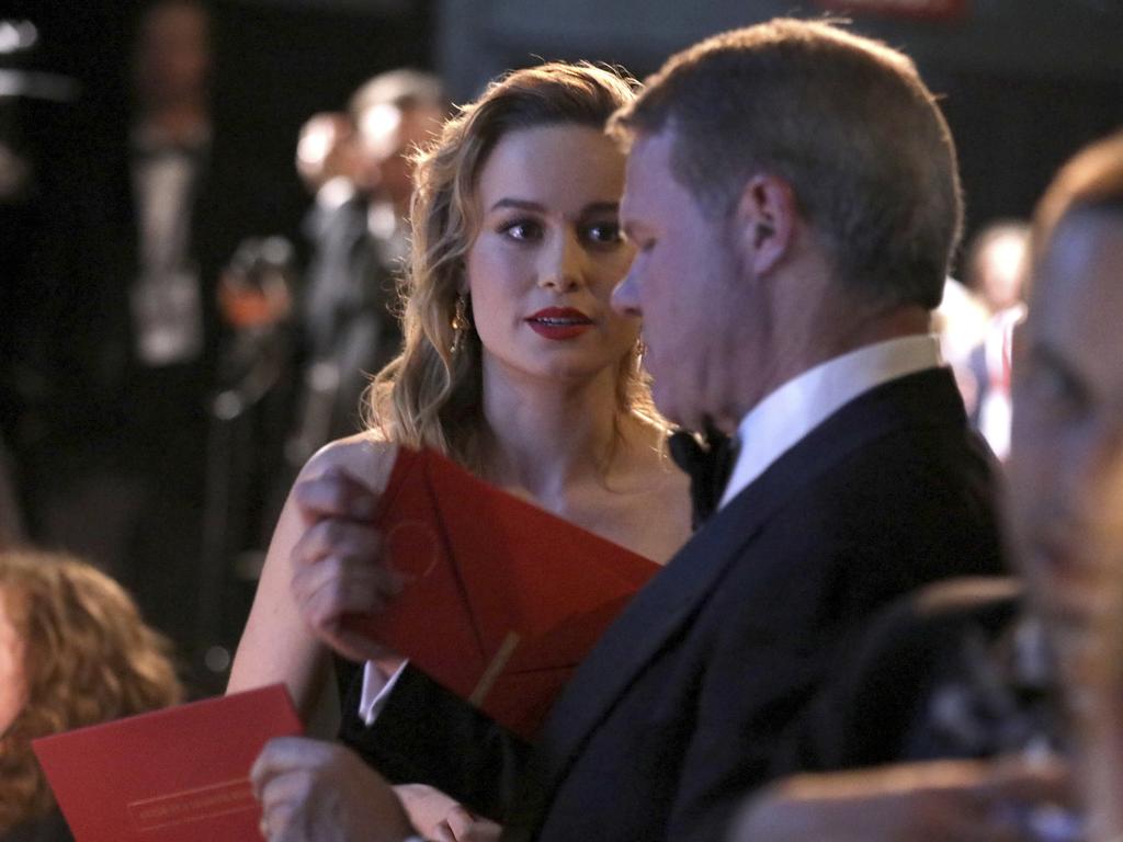 Brie Larson handed the “Best Actor” envelope by accountant Brian Cullinan backstage at the 89th Annual Academy Awards. Picture: AP