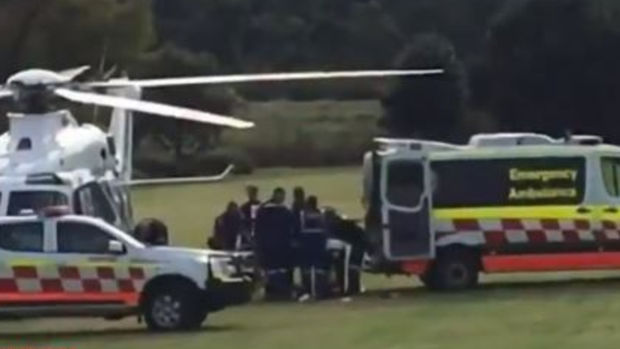 The woman is treated by paramedics. Picture: Nine News