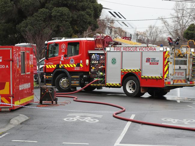 MELBOURNE, AUSTRALIA - NewsWire Photos, AUGUST 17, 2021. Police and fire fighters at the scene where following the arrest of a man following a fire at a service station in Fitzroy overnight: NCA NewsWire / David Crosling