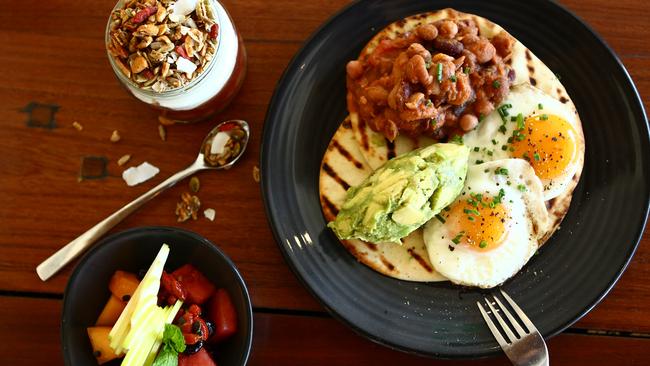 BSKT Breakfast Jar: Stewed apple and rhubarb, chia seeds, veganola and creamy protein yoghurt and Navajo Native Breakfast/ fried free range eggs, BSKT beans, avocado and tomato salsa with basil essential oil on native flat bread. Photo: Kit Wise