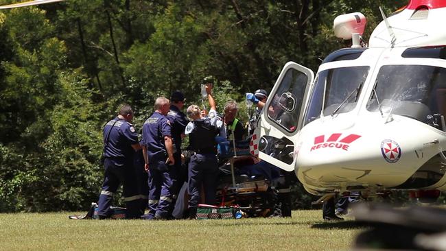 Emergency services treat the man pulled from the Colo River, near Putty Road. Picture: TNV