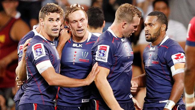 MELBOURNE, AUSTRALIA - FEBRUARY 23:  Dane Haylett-Petty of the Rebels celebreates a goal with teammates during the round two Super Rugby match between the Melbourne Rebels and the Queensland Reds at AAMI Park on February 23, 2018 in Melbourne, Australia.  (Photo by Daniel Pockett/Getty Images)