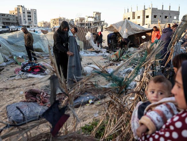 People inspect the site of reported Israeli bombardment on tents sheltering Palestinians displaced from Beit Lahia at a camp in Khan Yunis in the southern Gaza Strip on December 25, 2024. Picture: AFP