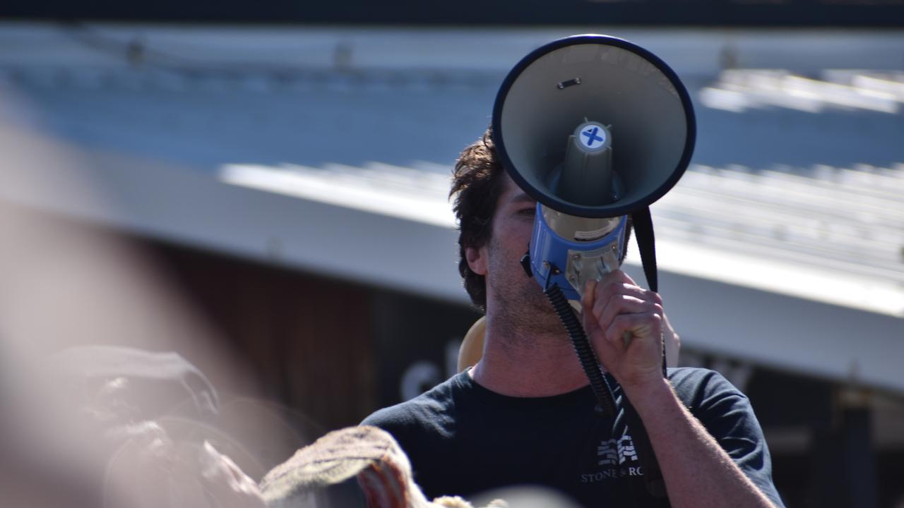 Protester chanting at the rally. Photo: Liana Walker