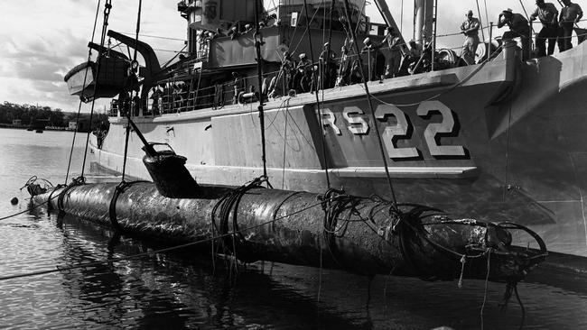 A Japanese midget submarine is lifted from water in West Loch of Pearl Harbor after the Japanese raid.