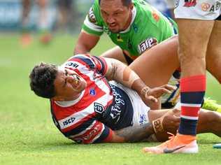 Latrell Mitchell of the Roosters is seen reacting after suffering an injury after scoring a try during the Round 9 NRL match between the Sydney Roosters and the Canberra Raiders at Suncorp Stadium in Brisbane, Sunday, May 12, 2019.  (AAP Image/Darren England) NO ARCHIVING, EDITORIAL USE ONLY. Picture: DARREN ENGLAND