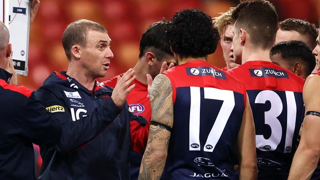 Simon Goodwin addresses his players during Saturday night’s match against the Suns. Picture: Cameron Spencer/Getty Images