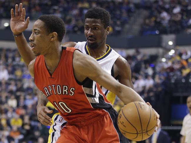 The Raptors' DeMar DeRozan goes to the basket against the Pacers' Solomon Hill.