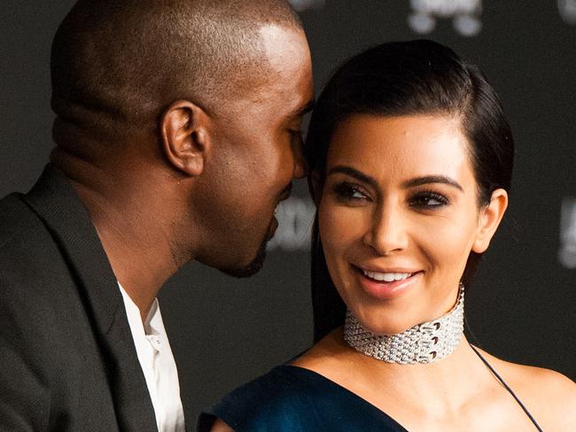 TOPSHOTS Kim Kardashian and her husband, recording artist Kanye West, arrive for the 2014 LACMA Art + Film Gala honoring film director Quentin Tarantino and artist Barbara Kruger in Los Angeles on November 1, 2014. AFP PHOTO / Valerie Macon