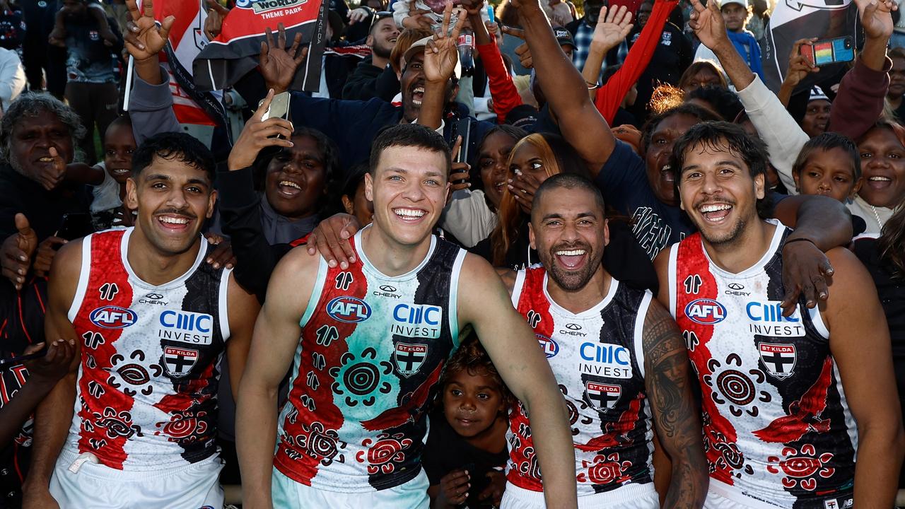 Wanganeen-Milera with Indigenous players Marcus Windhager, Bradley Hill and Isaac Keeler in Alice Springs. Picture: Michael Willson/AFL Photos via Getty Images