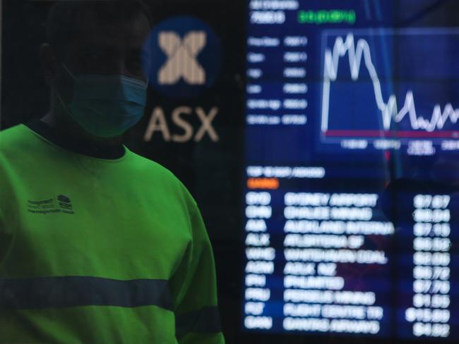 SYDNEY, AUSTRALIA - NewsWire Photos JULY 05, 2021: A member of the public is seen checking the stocks at the ASX in the CBD, as we enter week 2 of Covid-19  lockdown in Sydney Australia. Picture: NCA NewsWire / Gaye Gerard