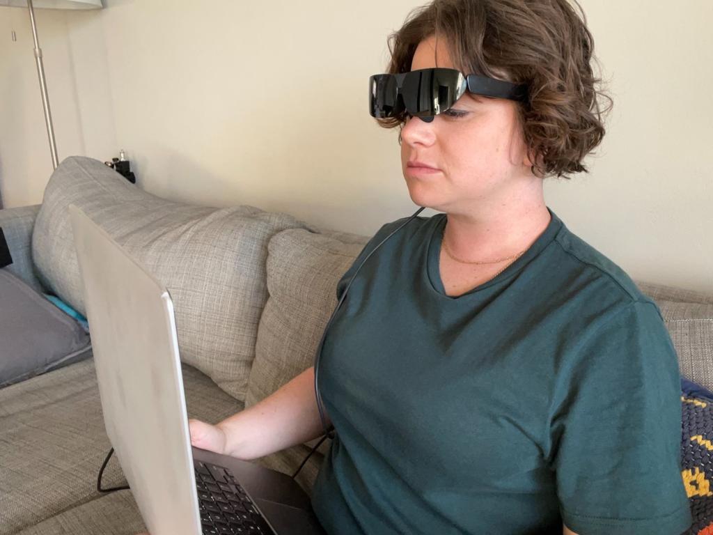 The glasses connect to laptops and smart devices.