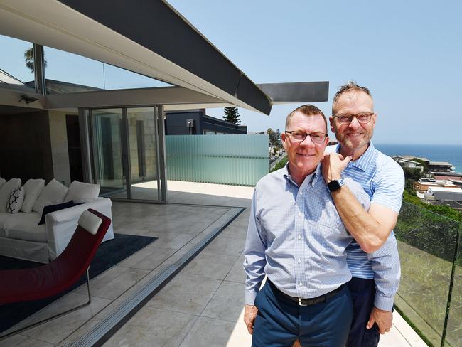 Fred Balboni (blue white short sleeve), 60, and partner Geoff Collins, 56, pose for a picture in Tamarama, Sydney, Friday, 3 January 2020. Mr Balboni says it is a happy coincidence that they are selling in the rising market. Picture - Sam Mooy/The Australian