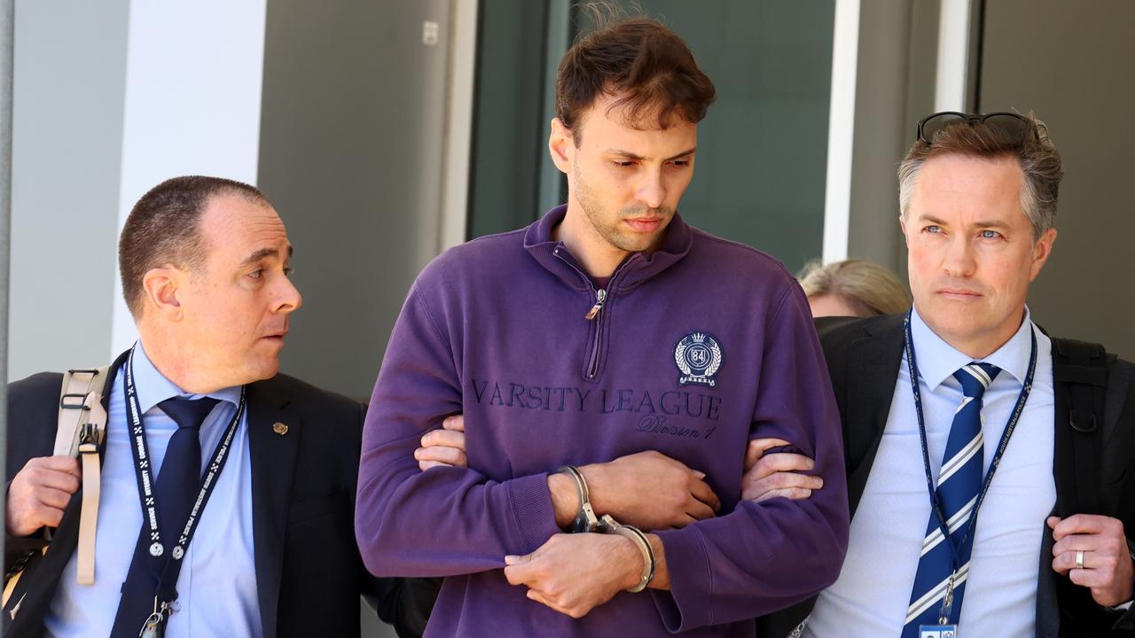 Zacharia Bruckner arrives at Adelaide Airport with police following his extradition from Queensland. Picture: NCA NewsWire / Kelly Barnes