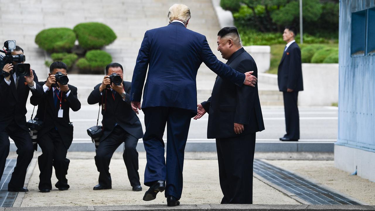 Mr Trump and Kim Jong-un at the Military Demarcation Line dividing North and South Korea in 2019. Picture: Brendan Smialowski/AFP